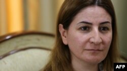 Lawmaker Vian Dakhil says she will return to the Iraqi parliament once she is fully recovered from injuries suffered in a helicopter crash on Mount Sinjar in August.