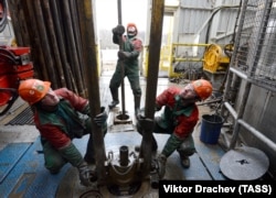 Workers drilling in an oil field in the Homel region that is operated by Belorusneft.