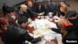 Tajik election workers counting ballots at a polling station in Dushanbe after votes were cast in a February 2010 election.