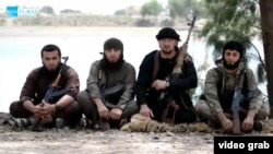 The defection to Islamic State of former Tajik special-forces commander Gulmorod Halimov (second from right) may be one of the reasons why so many of his compatriots have become suicide bombers for the extremist group. (file photo)