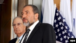 U.S. Envoy George Mitchell (left) and Israeli Foreign Minister Avigdor Lieberman