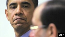 Iraqi Prime Minister Nuri al-Maliki (right) with U.S. President Barack Obama during a meeting in Baghdad on April 7