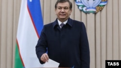 Shavkat Mirziyaev casts his ballot in Tashkent on December 4.