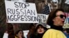 People participate in a "Stand With Ukraine" rally outside the United Nations in New York on February 17.