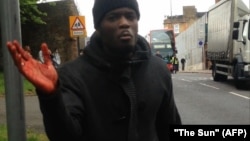 This video grab from "The Sun" newspaper shows one of the men believed to be involved in the murder speaking following the attack.