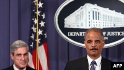 U.S. Attorney General Eric Holder (right) and FBI Director Robert Mueller divulge details of an alleged Iranian plot to kill the Saudi ambassador to the United States and bomb the embassies of Saudi Arabia and Israel in Washington. 