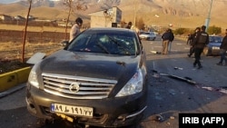 A photo made available by Iranian state TV shows the damaged car of Mohsen Fakhrizadeh after the attack near Tehran.