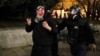 A Georgian police officers detains a demonstrator during an opposition rally in Tbilisi on November 30. 