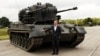 German Chancellor Olaf Scholz poses in front of a Gepard tank on August 25, 2022.