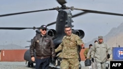 U.S. Vice President Joe Biden (left) arrives at an Afghan National Army training center in Kabul in January 2011.