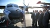 Russian President Vladimir Putin looks at a Let L-410 UVP-E20 Turbolet transport aircraft during a visit to Patriot military park outside Moscow in 2018. 