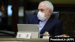 Iranian Foreign Minister Mohmmad Javad Zarif wears a protective mask during a cabinet meeting in Tehran on March 11. 