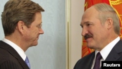 Belarusian President Alyaksandr Lukashenka (right) welcomes German Foreign Minister Guido Westerwelle to Minsk.