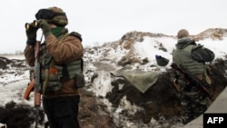 Ukrainian servicemen man a checkpoint near Lysychansk in the Luhansk region of eastern Ukraine.