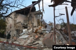 The remains of a Stepanakert house where three people were reportedly killed in a Smerch rocket attack overnight on November 5-6.