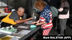 A woman casts her ballot at a polling station during midterm elections in Huntington Beach, California on November 6.