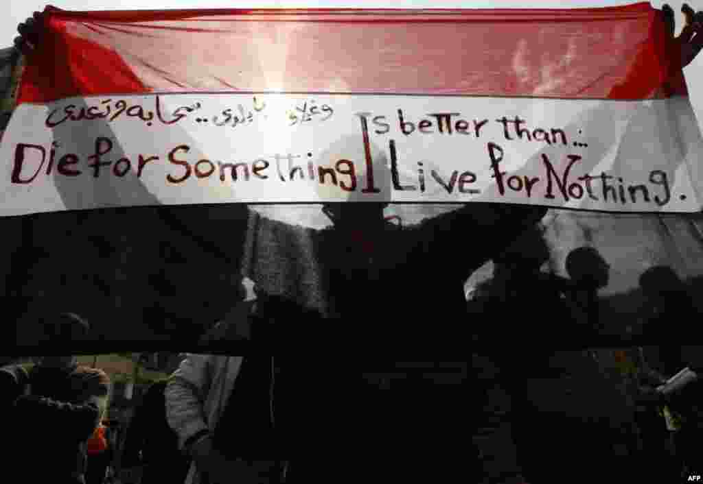 A demonstrator takes part in a protest against President Hosni Mubarak's regime at Tahrir Square on January 30.