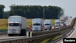 The Russian convoy of trucks carrying aid heads toward Ukraine.