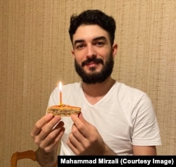 Mirzali celebrates his 27th birthday with a slice of baklava earlier this year.