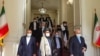 Iranian Foreign Minister Mohammad Javad Zarif (right) met with the Taliban's Mullah Abdul Ghani Baradar (center) in Tehran on January 31.