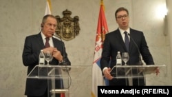 Russian Foreign Minister Sergei Lavrov (left) and Serbian President Aleksandar Vucic meet reporters in Belgrade on February 21.