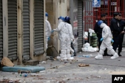 French forensics teams at work outside a building in the northern Paris suburb of Saint-Denis on November 19