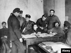 A Kronstadt sailor is questioned by Bolsheviks after the crushing of the rebellion.