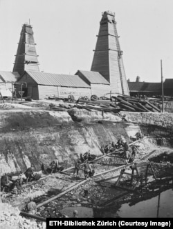 A hole being dug that would have been used to store oil.