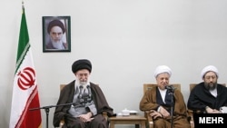 "Taqiyyeh, anyone?" Iran Supreme Leader Ali Khamenei (left) and Akbar Hashemi Rafsanjani (center) in Tehran on February 25