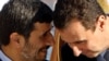 Iranian President Mahmud Ahmadinejad (left) with his Syrian counterpart Bashar al-Assad