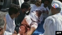 Iran's official Arabic-language Al-Alam TV shows a wounded man arriving at a hospital in the southeastern Iranian city of Pishin, near the border with Pakistan, on October 18.