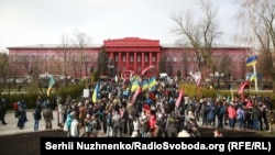 Protesters march in Kyiv on December 3 calling for the legislation that would facilitate the impeachment of the president. 