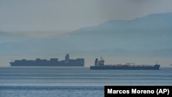 One of the Iranian vessels (right) is seen in international waters crossing the Gibraltar stretch on May 20.