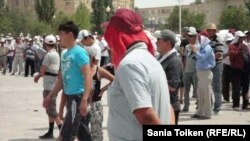 Striking Kazakh oil workers and their families at a rally in July