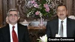 Presidents Serzh Sarkisian (left) and Ilham Aliyev in Prague in May -- the latest in 15 years of negotiations.