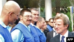 French Foreign Minister Bernard Kouchner (right) meets with international observers in Gori.