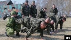 Members of the newly founded Ukrainian National Guard take part in a training session on the Noviy Petrivtsi shooting range near Kyiv last month.