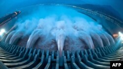 Water is released from the massive Three Gorges Dam, a hydropower project on the Yangtze River in Yichang, in central China's Hubei province, on July 24.