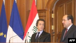 President Sarkozy (left) with Prime Minister al-Maliki at a joint press conference in Baghdad on February 10