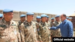 Armenian Defense Minister Seyran Ohanian inspects Armenian troops serving in Afghanistan in July.