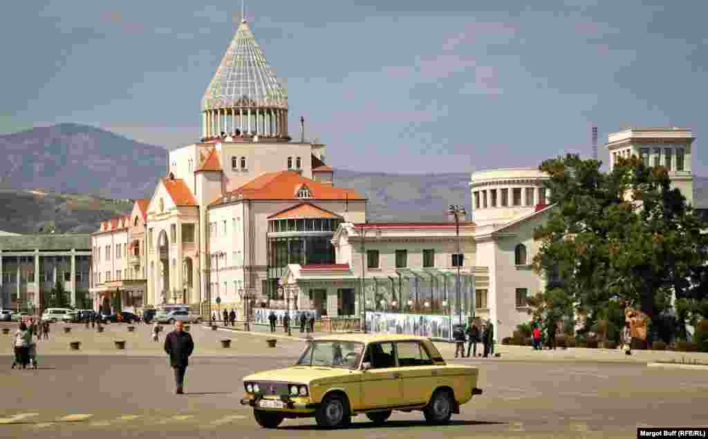 A car passes by the parliament of Nagorno-Karabakh. The region declared independence in 1991, a status that is not recognized outside its borders.