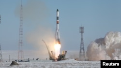 A Russian Soyuz booster rocket, carrying the Progress cargo space craft, blasts off for the International Space Station from the Baikonur cosmodrome in February 2017.