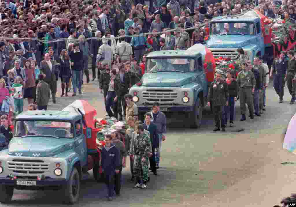 People follow a funeral procession for the three victims of the coup in front of Russian White House in Moscow on August - People follow a funeral procession for the three victims of the coup in front of Russian White House in Moscow on August 24, 1991.