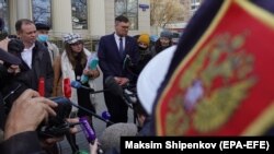 Lawyers for Navalny's organizations speak to the media at the Moscow City Court on April 26.