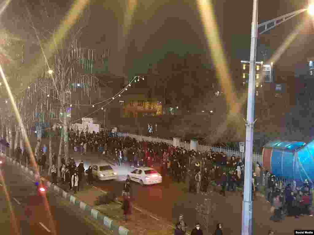 Protesters gather in front of the Ostad Moein subway station on January 12. Anti-government slogans targeting Iran&#39;s conservative-clerical establishment could be heard.