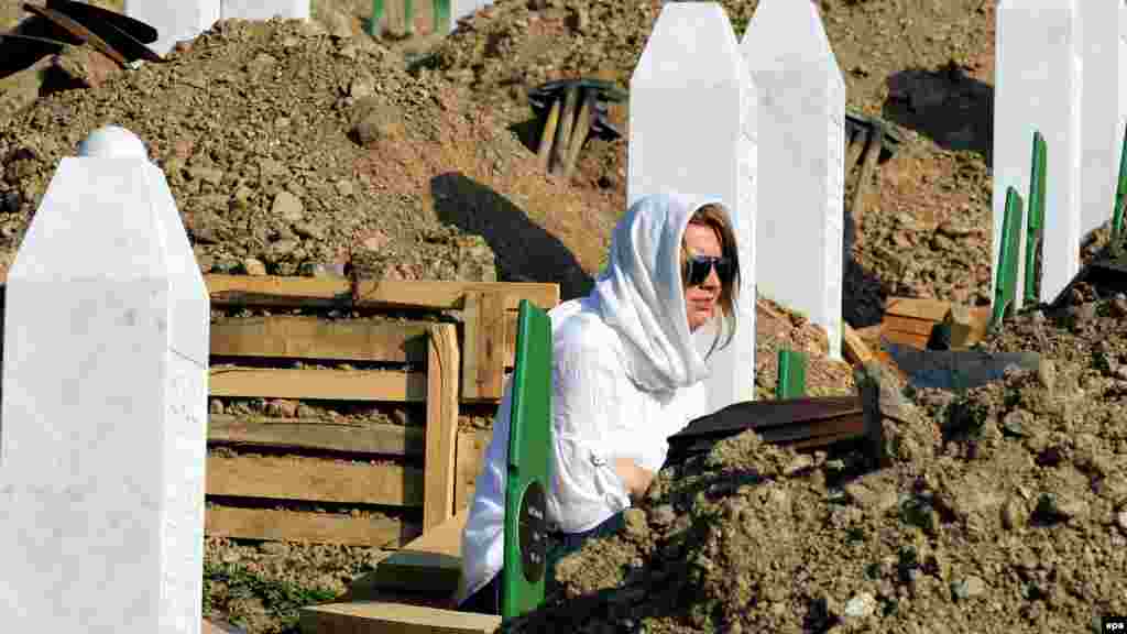 A woman weeps at the Potocari Memorial Center during the funeral ceremony in Srebrenica on July 11.