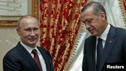 Turkish Prime Minister Recep Tayyip Erdogan (right) meets with Russian President Vladimir Putin in Istanbul.