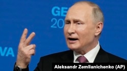 Russian President Vladimir Putin gestures as he speaks during a news conference after his meeting with U.S President Joe Biden in Geneva on June 16. 