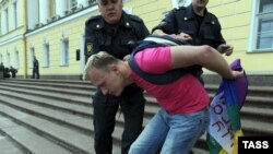 A gay activist is detained by police during a gay-pride parade in St. Petersburg in June 2011.