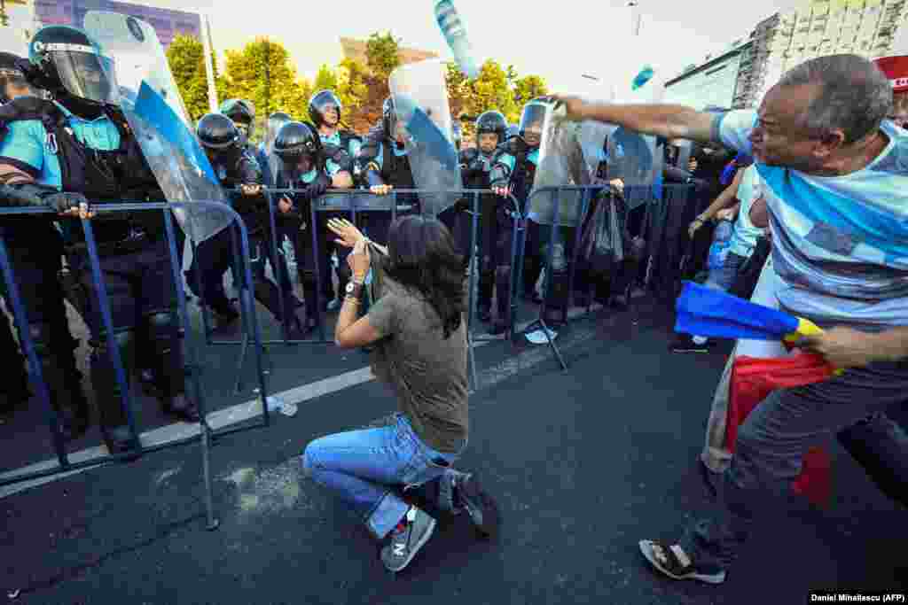 Some in the crowd threw rocks and other projectiles at police, while police used pepper spray, water cannons, and tear gas against the crowd.